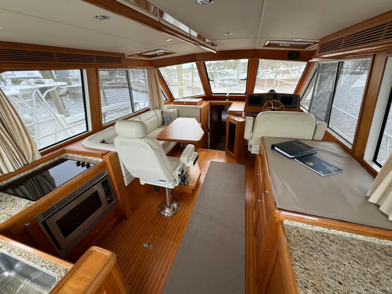 Slide: The Image of Interior of 2009 Grand Banks 45 Eastbay SX yacht with luxurious seating and navigation area. - 27