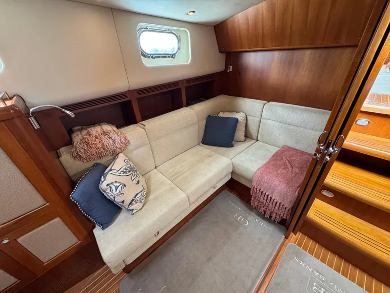 Slide: The Image of Luxurious interior of 2009 Grand Banks 45 Eastbay SX yacht with cozy seating area. - 34