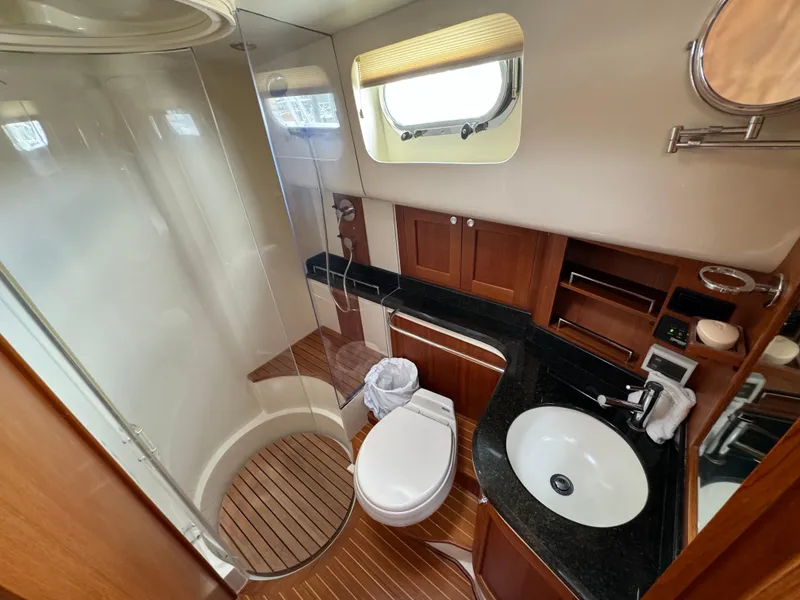 Slide: The Image of Luxurious 2009 Grand Banks 45 Eastbay SX yacht bathroom with wood accents and modern fixtures. - 45