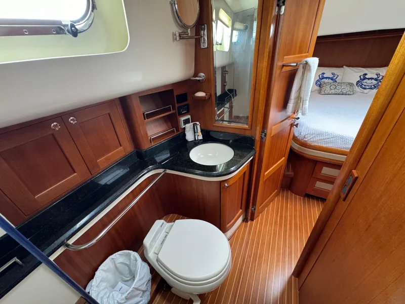 Slide: The Image of Luxurious 2009 Grand Banks 45 Eastbay SX yacht bathroom with wood accents and modern amenities. - 47