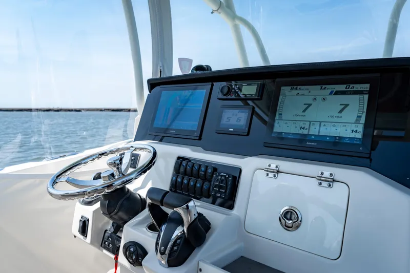 Slide: The Image of 2023 Sailfish 290 CC boat dashboard with advanced navigation and control systems. - 10