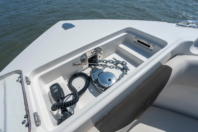 Slide: The Image of Anchor compartment of 2023 Sailfish 290 CC boat with chain and controls. - 18