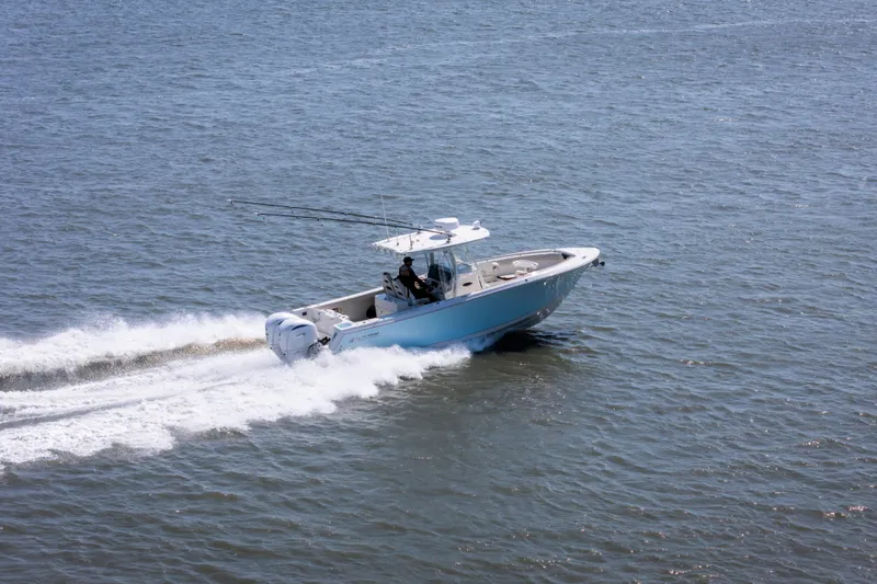 Slide: The Image of 2023 Sailfish 290 CC boat cruising on open water, showcasing speed and performance. - 8