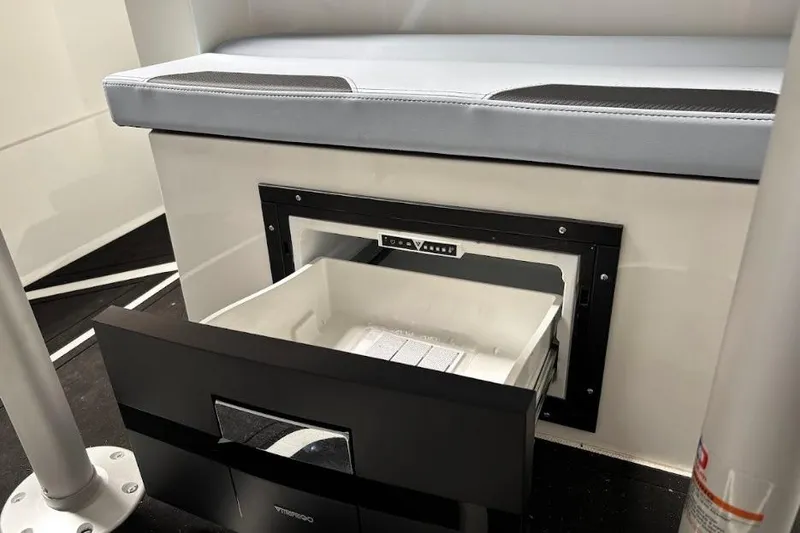 Slide: The Image of Interior of 2026 Iron 907 Coupe featuring a built-in storage drawer under seating. - 12