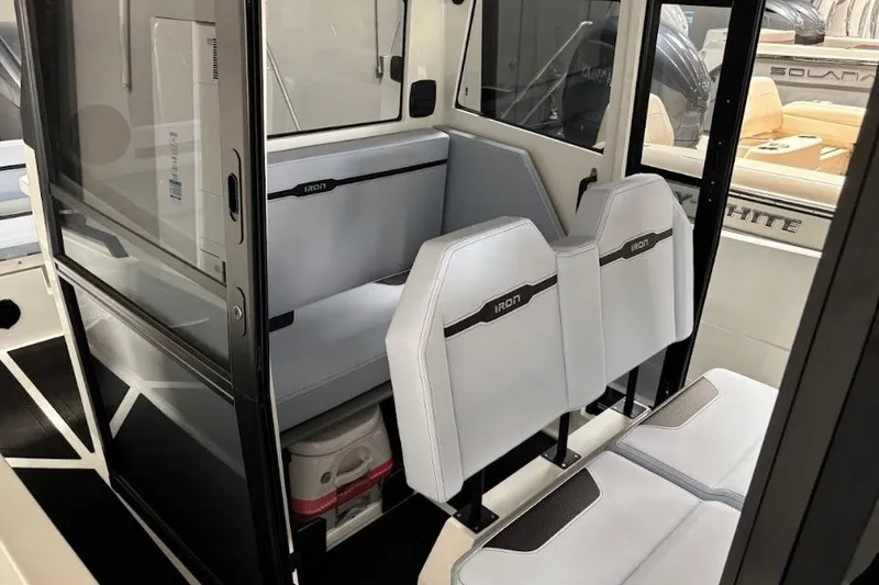 Slide: The Image of Interior of 2026 Iron 907 Coupe boat with modern seating and sleek design. - 15