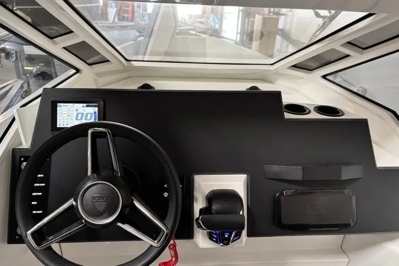 Slide: The Image of Interior dashboard of 2026 Iron 907 Coupe with steering wheel and digital display. - 18