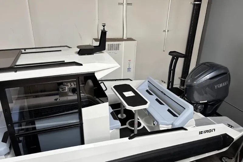 Slide: The Image of 2026 Iron 907 Coupe boat interior with Yamaha engine, featuring sleek seating and modern design. - 21