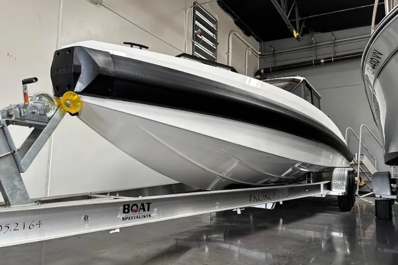 Slide: The Image of 2026 Iron 907 Coupe boat on trailer in indoor storage facility. - 24