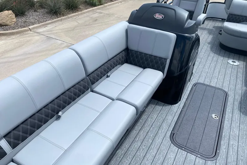 Slide: The Image of 2026 Ranger 223FC boat interior with gray seating and diamond-patterned accents. - 10