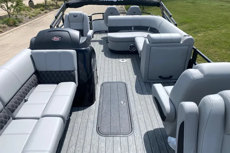 Slide: The Image of 2026 Ranger 223FC boat interior with luxurious gray seating and spacious layout. - 11