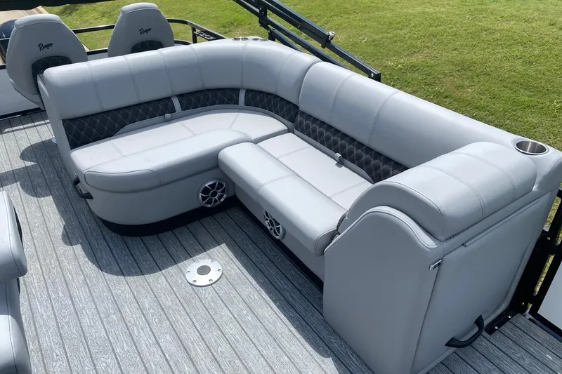 Slide: The Image of Luxurious tan and black leather seating in 2026 Ranger 223FC with diamond stitching. - 13