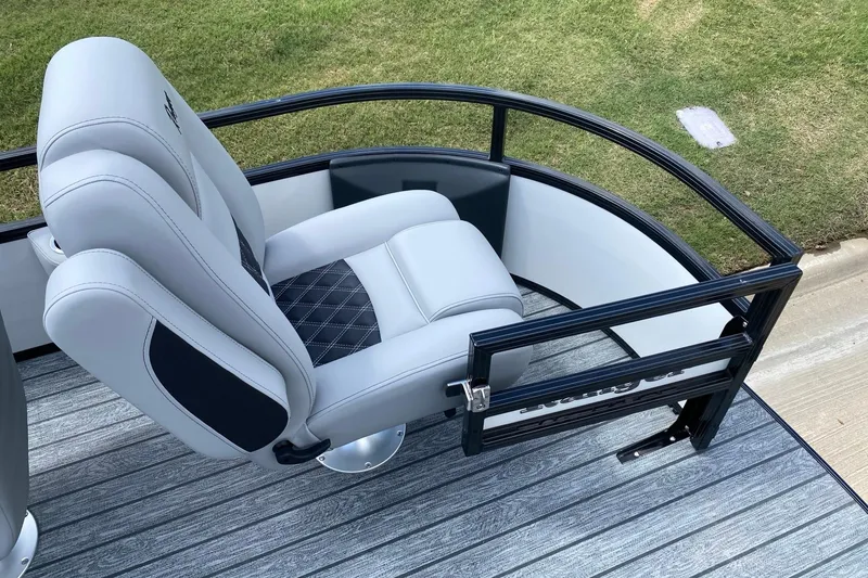 Slide: The Image of 2026 Ranger 223FC boat interior with tan seating, storage compartments, and modern design. - 7