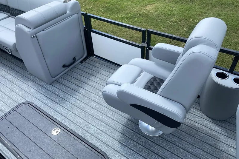 Slide: The Image of Interior of 2026 Ranger 223FC boat with gray seating and cup holders on deck. - 8