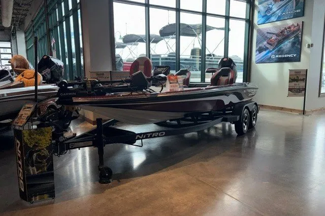 The Image of 2026 Nitro Z20 XL Pro boat displayed in a showroom with large windows. - 0