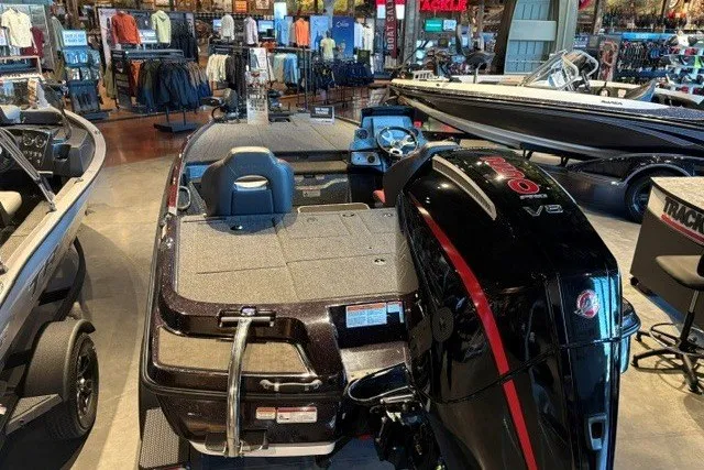 Slide: The Image of 2026 Nitro Z20 XL Pro boat displayed in a showroom with other marine equipment. - 2