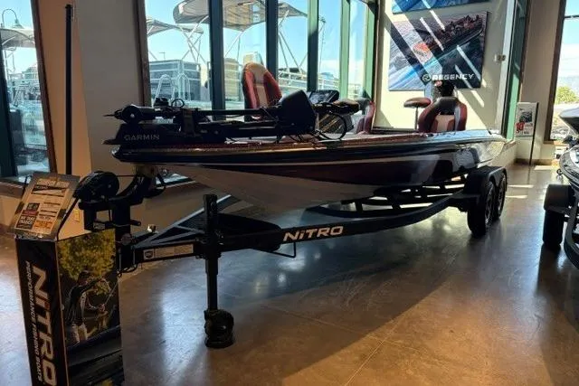 Slide: The Image of 2026 Nitro Z20 XL Pro boat displayed indoors on a trailer. - 1