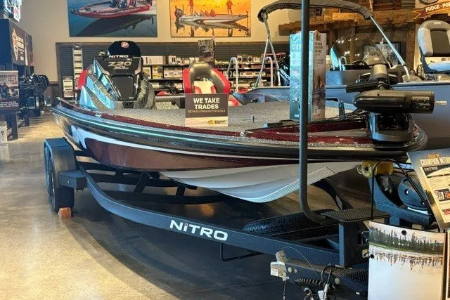 Slide: The Image of 2026 Nitro Z20 XL Pro boat displayed in showroom, featuring sleek design and trade-in offer sign. - 1