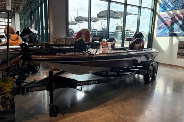 Slide: The Image of 2026 Nitro Z20 XL Pro boat displayed indoors with sleek design and advanced features. - 115