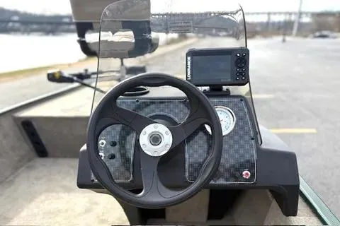 Slide: The Image of 2026 Tracker Bass Tracker Classic Limited boat dashboard with steering wheel and navigation system. - 10
