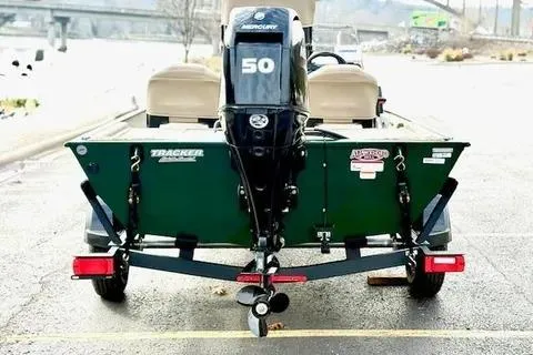 Slide: The Image of 2026 Tracker Bass Tracker Classic Limited boat with Mercury 50 engine, rear view. - 12