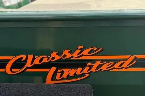 Slide: The Image of 2026 Tracker Bass Tracker Classic Limited logo on green surface. - 14