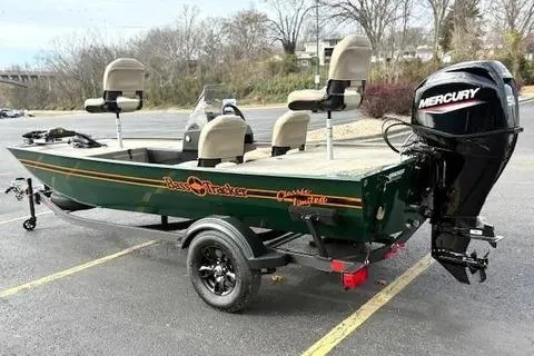 Slide: The Image of 2026 Tracker Bass Tracker Classic Limited boat with Mercury engine in parking lot. - 3