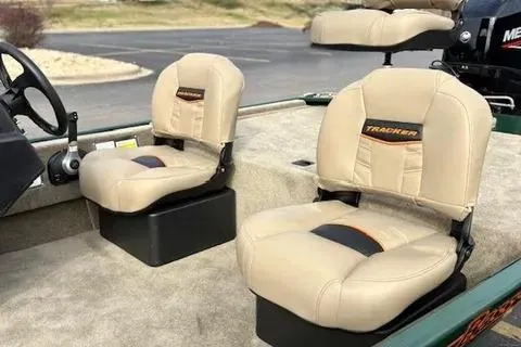 Slide: The Image of 2026 Tracker Bass Tracker Classic Limited boat seats, beige upholstery, outdoor setting. - 8