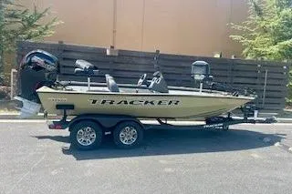 The Image of 2026 Tracker Pro Team 195 boat on trailer, parked outdoors. - 0