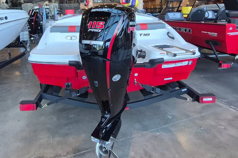 Slide: The Image of 2026 Tahoe T18 boat with Mercury 115 Pro outboard motor in showroom. - 6
