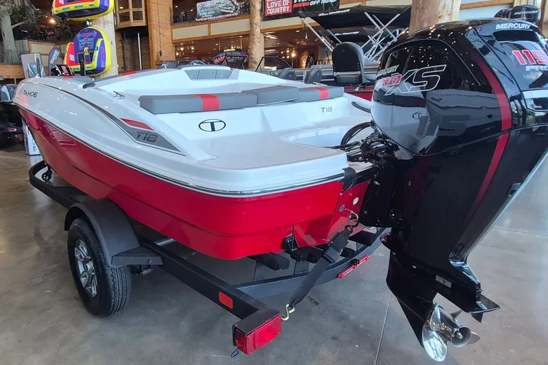 Slide: The Image of 2026 Tahoe T18 boat with Mercury 115 Pro XS engine, displayed indoors on a trailer. - 5