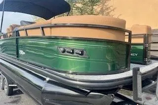 Slide: The Image of Luxurious seating area on 2026 Regency 230 DL boat with cup holders and table. - 12