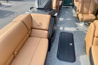 Slide: The Image of 2026 Regency 230 DL boat interior with tan leather seating and modern design. - 5