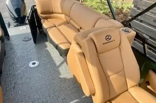 Slide: The Image of 2026 Regency 230 DL pontoon boat on trailer, featuring sleek design and modern amenities. - 8