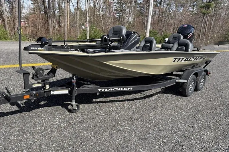 The Image of 2026 Tracker Pro Team 195 fishing boat on trailer, parked on a road. - 0