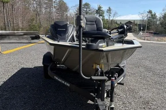 Slide: The Image of 2026 Tracker Pro Team 195 boat on trailer, parked on a road. - 5