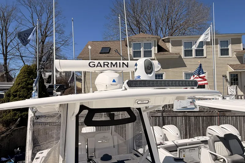 Slide: The Image of 2022 Regulator 28 Forward Seating boat interior with toilet and sink. - 10