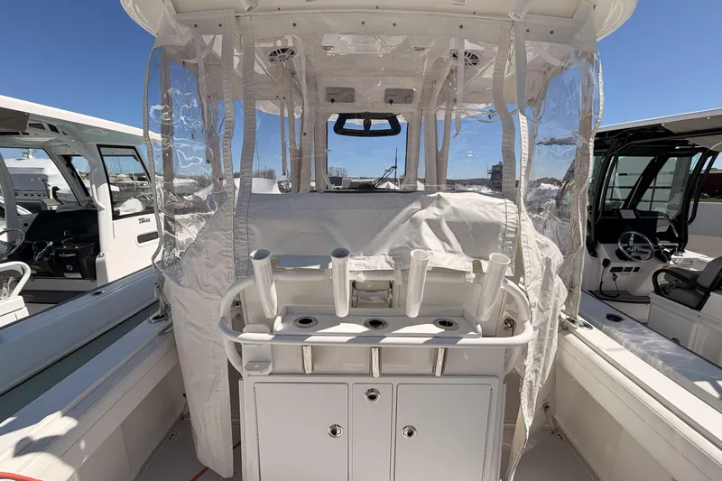 Slide: The Image of 2022 Regulator 28 Forward Seating helm with dual displays and modern controls. - 13