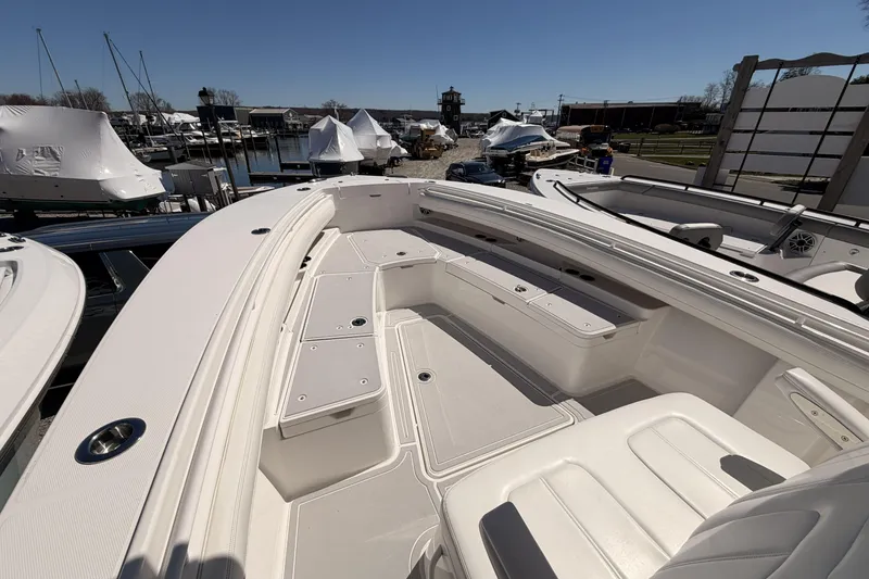 Slide: The Image of 2022 Regulator 28 Forward Seating helm with dual displays and modern controls. - 15