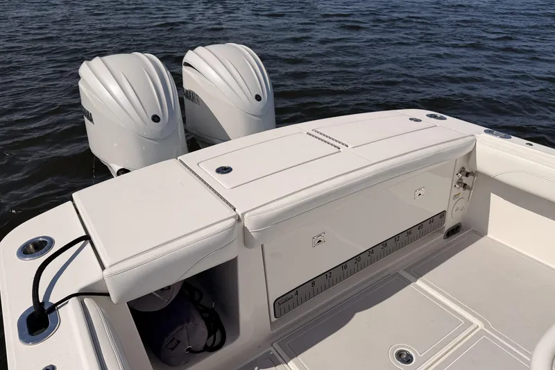 Slide: The Image of 2022 Regulator 28 Forward Seating boat with dual engines on water. - 18
