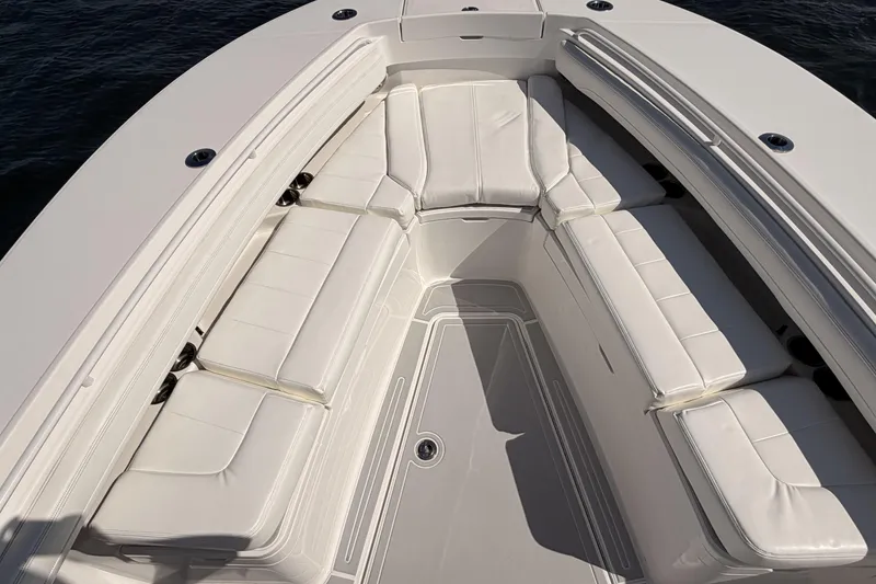 Slide: The Image of 2022 Regulator 28 Forward Seating with luxurious white cushions. - 19