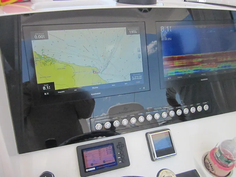 Slide: The Image of Dashboard of 2023 Regulator 28 Forward Seating with navigation and sonar displays. - 3