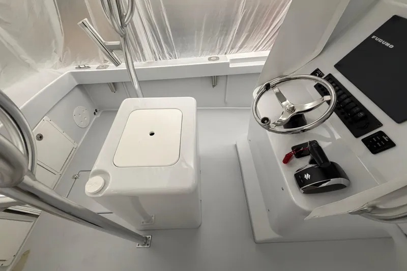 Slide: The Image of 1975 SeaCraft SC 23 Classic boat interior with steering wheel and control panel. - 10