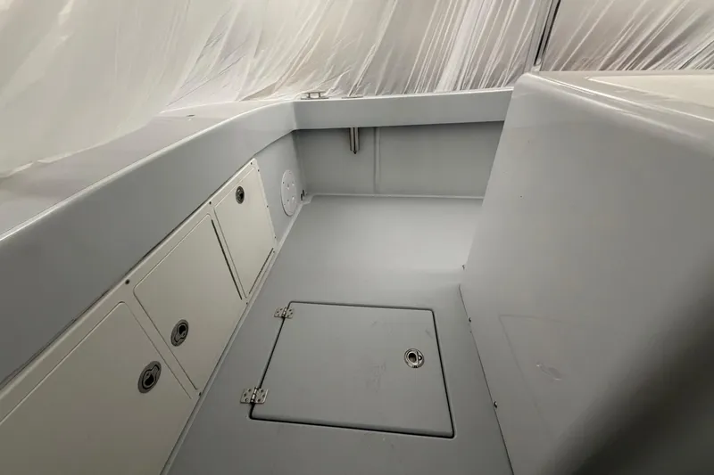 Slide: The Image of 1975 SeaCraft SC 23 Classic boat interior with storage compartments and clean design. - 12