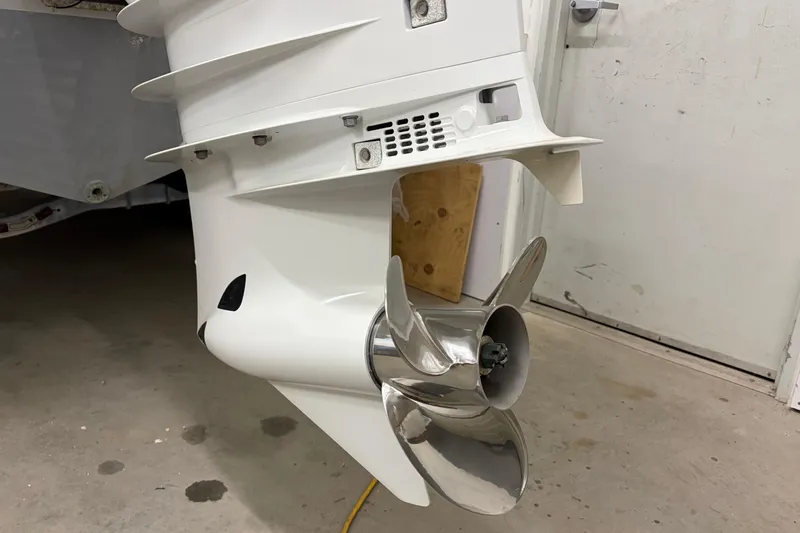 Slide: The Image of 1975 SeaCraft SC 23 Classic boat propeller in a garage setting. - 14