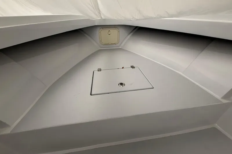 Slide: The Image of Interior view of a 1975 SeaCraft SC 23 Classic boat, featuring storage compartments. - 3