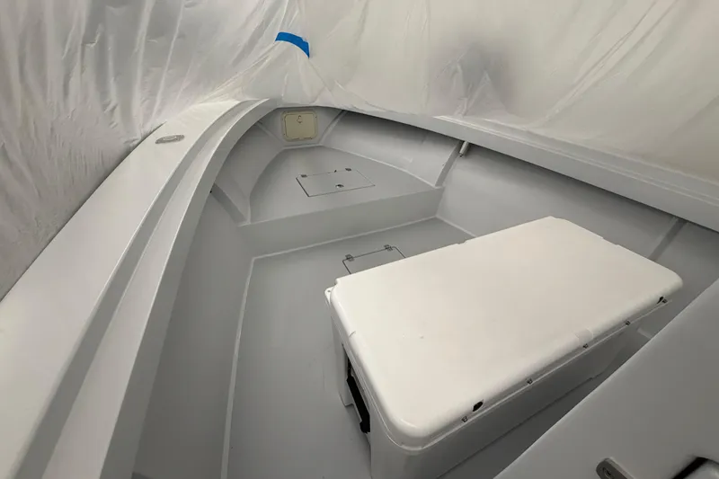 Slide: The Image of 1975 SeaCraft SC 23 Classic boat interior with white seating and storage compartments. - 4