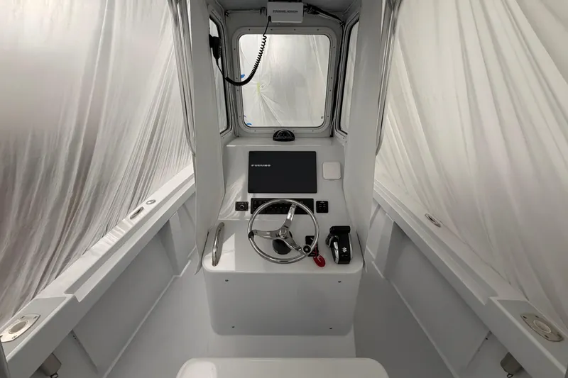 Slide: The Image of Interior of a 1975 SeaCraft SC 23 Classic boat with modern navigation equipment. - 6