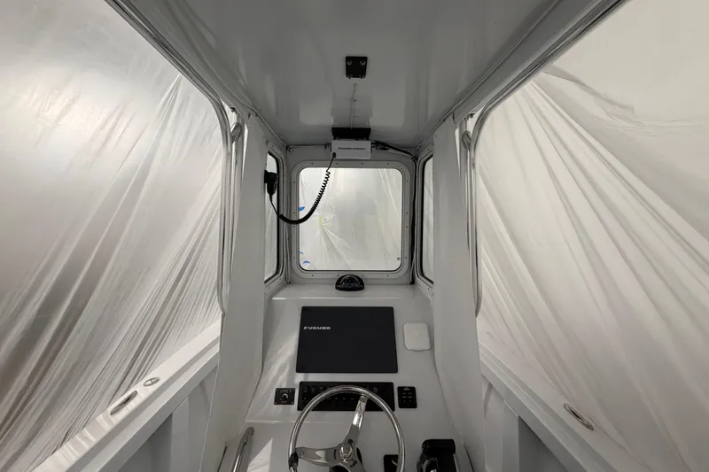 Slide: The Image of Interior of a 1975 SeaCraft SC 23 Classic boat with modern navigation equipment. - 7