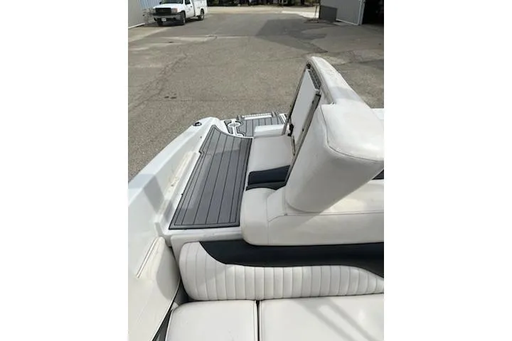 Slide: The Image of 2011 Crownline 21 SS boat interior with white seating and gray flooring. - 10