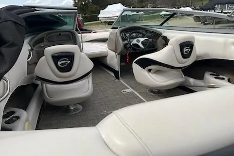 Slide: The Image of 2011 Crownline 21 SS boat interior with plush seating and modern dashboard. - 7